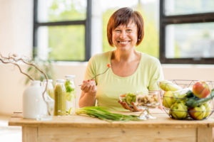 woman smiling eating lunch