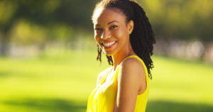 woman smiling in a field