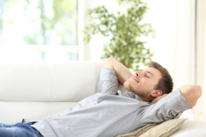 man resting on the couch