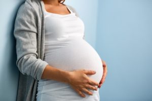 pregnant woman after visiting her holistic dentist in Southlake 