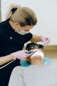 Dentist in Southlake performing dental treatment.