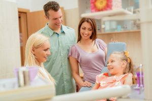 Parents and child at family dentist in Southlake. 