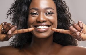 Woman with healthy smile after treatment with functional orthodontics