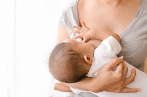 Mother nursing her baby after tongue tie treatment in Southlake