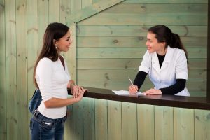 Patient checking in for appointment with holistic dentist in Southlake