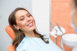 Smiling patient attending checkup with dentist in Southlake