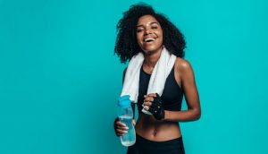 Smiling woman dressed in workout clothes