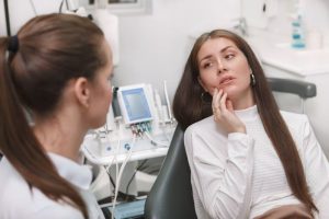 Woman at dentist’s office, complaining of jaw pain