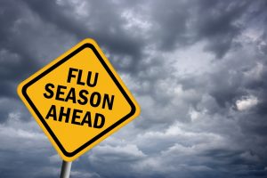 Yellow sign warning of “flu season ahead”