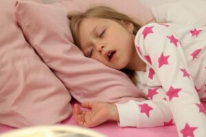 Young girl sleeping with mouth open