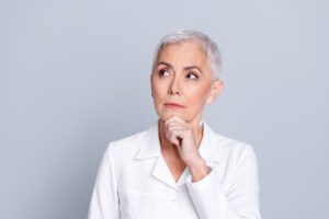Mature woman wearing curious expression 