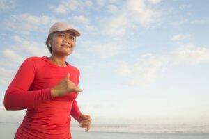 Middle-aged woman jogging outdoors